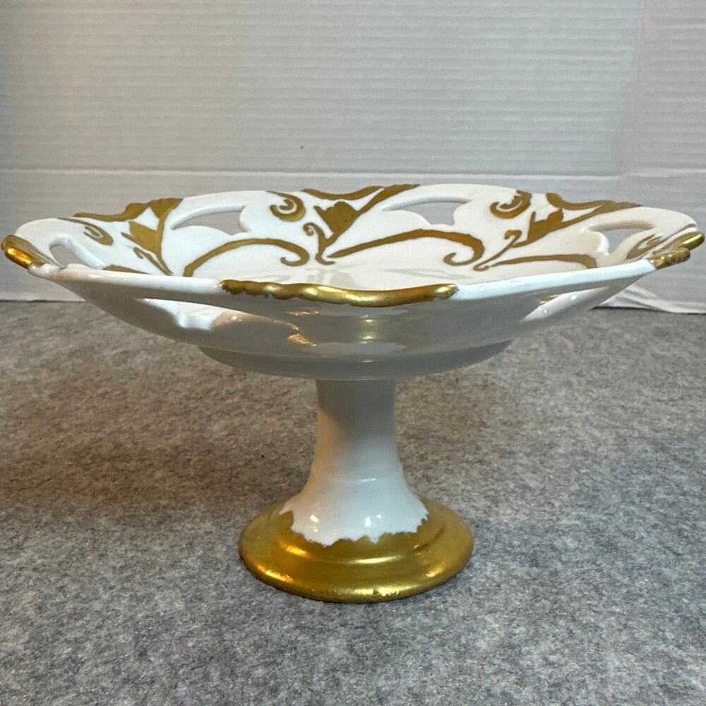 Vintage pedestal dish crafted from porcelain w/delicate gold filigree accents